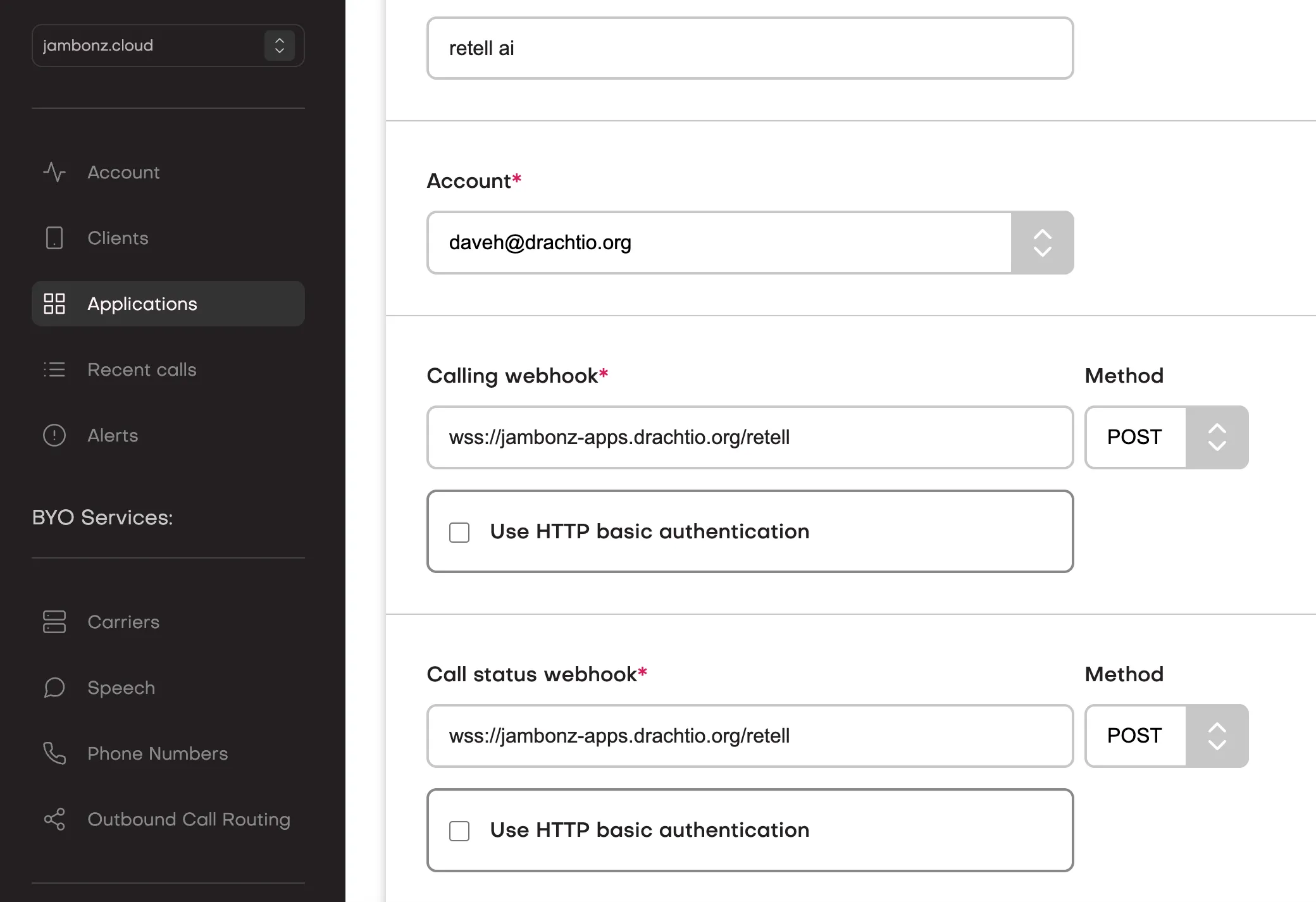 A jambonz application with its calling and call status webhooks set to a wss URL
